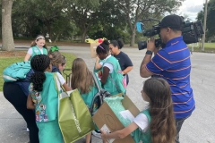 Arriving and unloading supplies while CHANNEL 6 films.